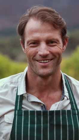 Young-happy-farmer-holding-a-basket-of-vegetables