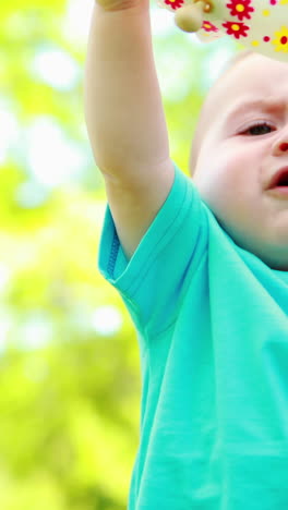 Cute-baby-boy-playing-with-a-pinwheel