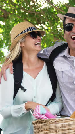 Smiling-couple-with-a-bicycle-on-a-sunny-day