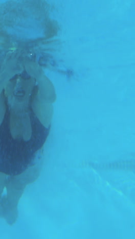 Low-angle-view-of-fit-swimmer-in-pool