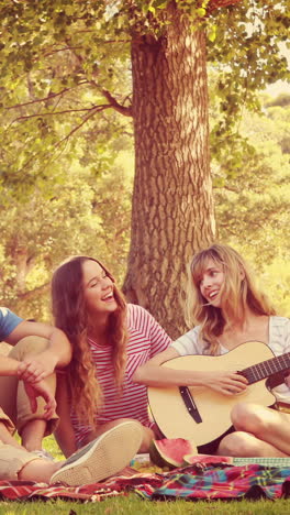 Happy-friends-talking-together-in-the-park