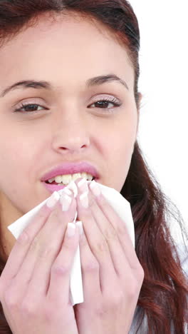 Woman-blowing-nose-with-tissue-paper-