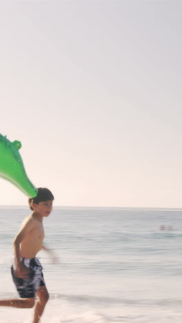 Father-and-son-playing-with-a-crocodile-buoy