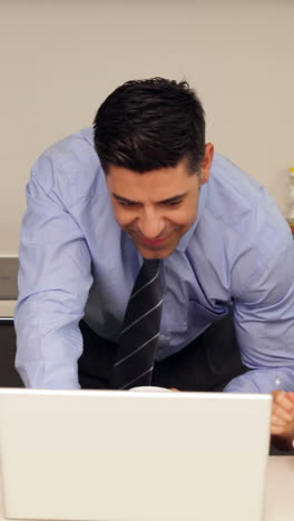 Smiling-father-using-laptop-with-children-before-he-goes-to-work