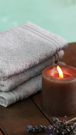 Towels-candles-and-dried-lavender-by-the-pool