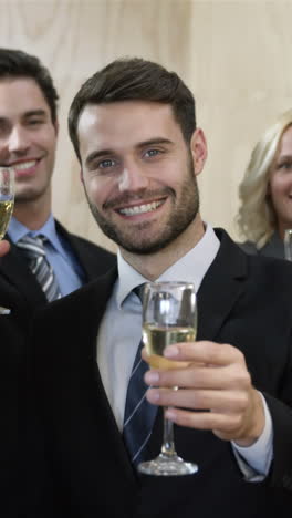 Business-people-toasting-with-champagne