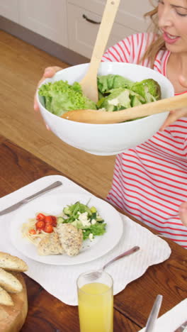 Family-having-dinner-together-in-kitchen