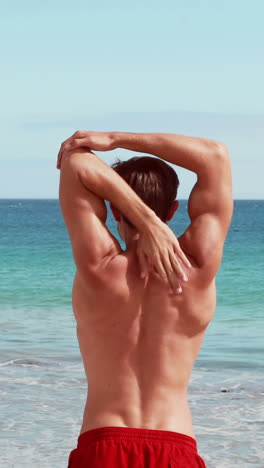 Attractive-man-stretching-his-arms