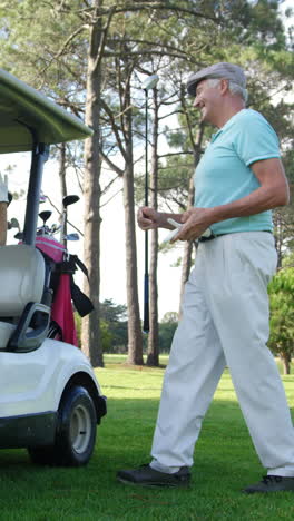 Male-golf-player-interacting-with-woman