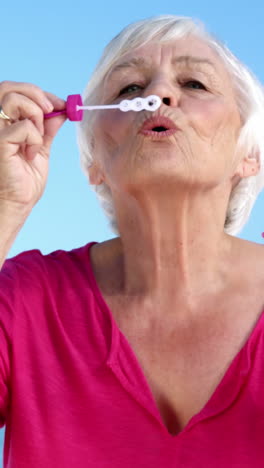 Senior-woman-making-bubbles