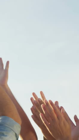 Group-of-friends-doing-high-five