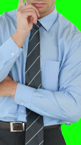 Thoughtful-businessman-using-an-invisible-board