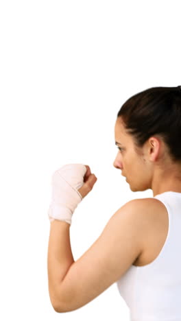 Fit-brunette-punching-with-bandaged-fists