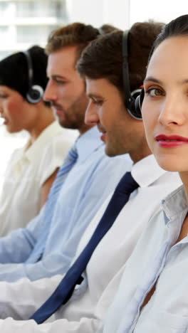 Happy-call-centre-agent-looking-to-camera