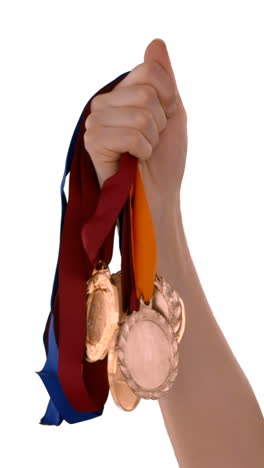 Manos-Lanzando-Algunas-Medallas