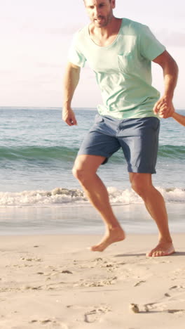 Happy-family-walking-on-the-sand