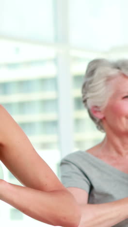 Women-at-a-yoga-class-in-tree-pose-pose