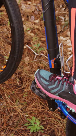 Close-up-of-mountain-biker-riding-in-the-forest