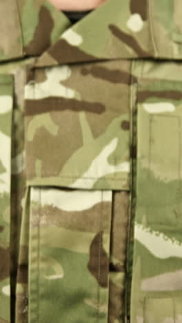 Close-up-of-soldier-holding-dairy-on-white-background