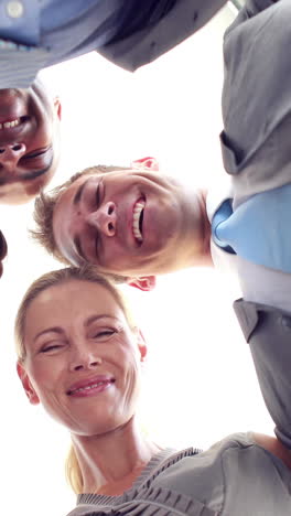 Smiling-business-people-looking-at-camera