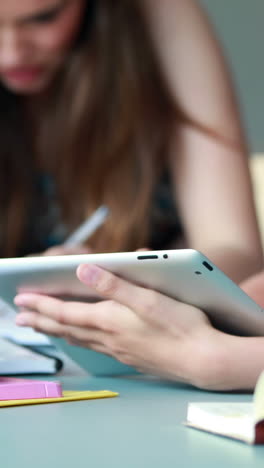 Classmates-studying-and-using-tablet-pc