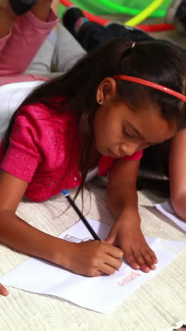 Cute-classmates-drawing-together-on-the-floor