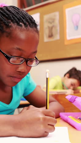 Young-little-girl-drawing-with-pencil