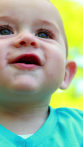 Adorable-baby-boy-playing-on-the-grass