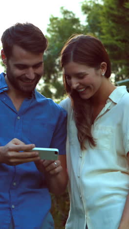 Happy-couple-taking-selfie-in-the-garden