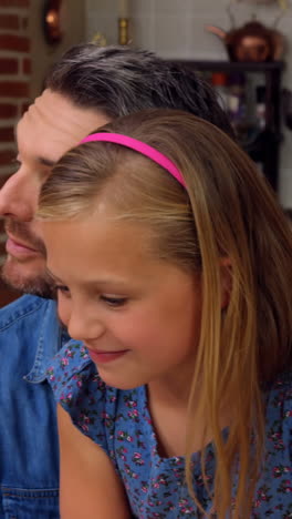 Family-having-dinner-together-in-kitchen