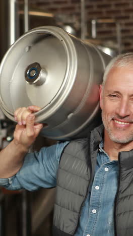 brewery-worker-holding-a-beer-barrel