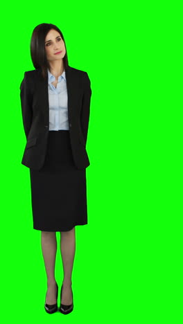 Unsmiling-businesswoman-pointing-at-screen-