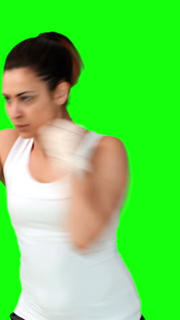 Fit-brunette-punching-with-bandaged-fists