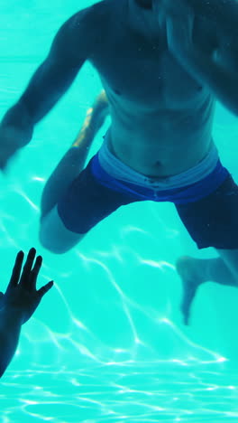 Attractive-woman-looking-at-underwater-boyfriend