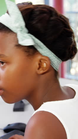 Schoolgirls-using-computer-in-classroom