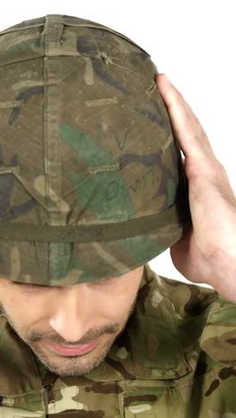 Soldier-wearing-combat-helmet-on-white-background