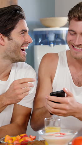 Cute-couples-cooking-and-laughing-in-kitchen