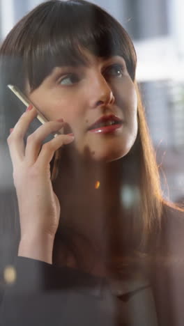 Businesswoman-talking-on-mobile-phone