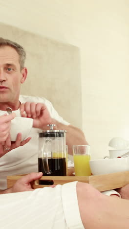 Mature-couple-having-breakfast-together