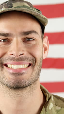 Soldier-standing-in-front-of-American-flag