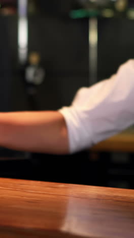 Bartender-in-uniform-cleaning