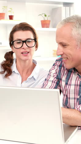 Casual-business-workers-using-laptop-computer