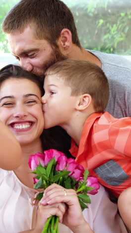 Mom-receiving-flowers-and-kisses