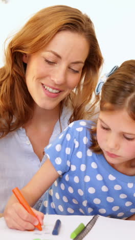 Parents-and-daughter-colouring-together-at-the-table