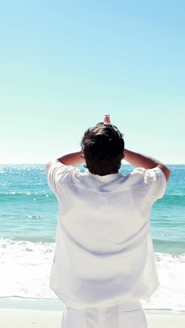 Man-meditating-on-the-beach