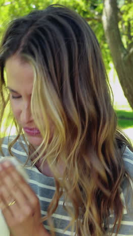 Woman-blowing-nose-with-tissue-paper