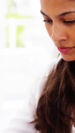 woman-in-office-using-smartphone