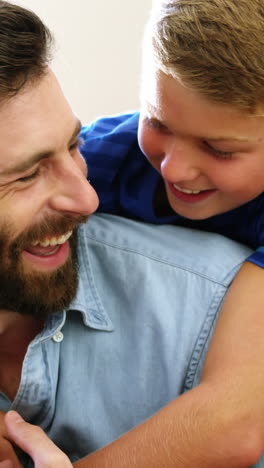 Happy-father-and-son-holding-each-other