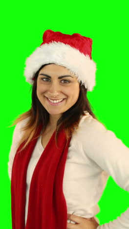 Woman-in-santa-hat-and-warm-clothing-blowing-over-hands-