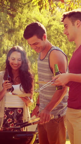 Happy-friends-in-the-park-having-barbecue